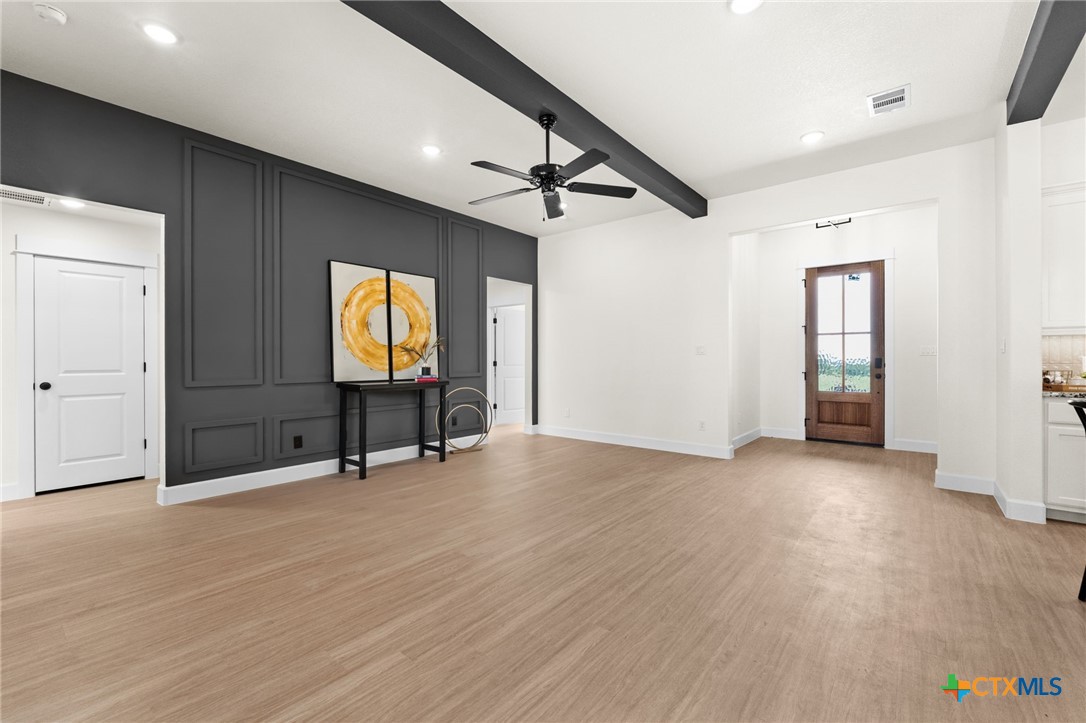 3025 Millhouse Road Copperas Cove, TX 76522 - Photo 6 of 38 an empty room with wooden floor and windows