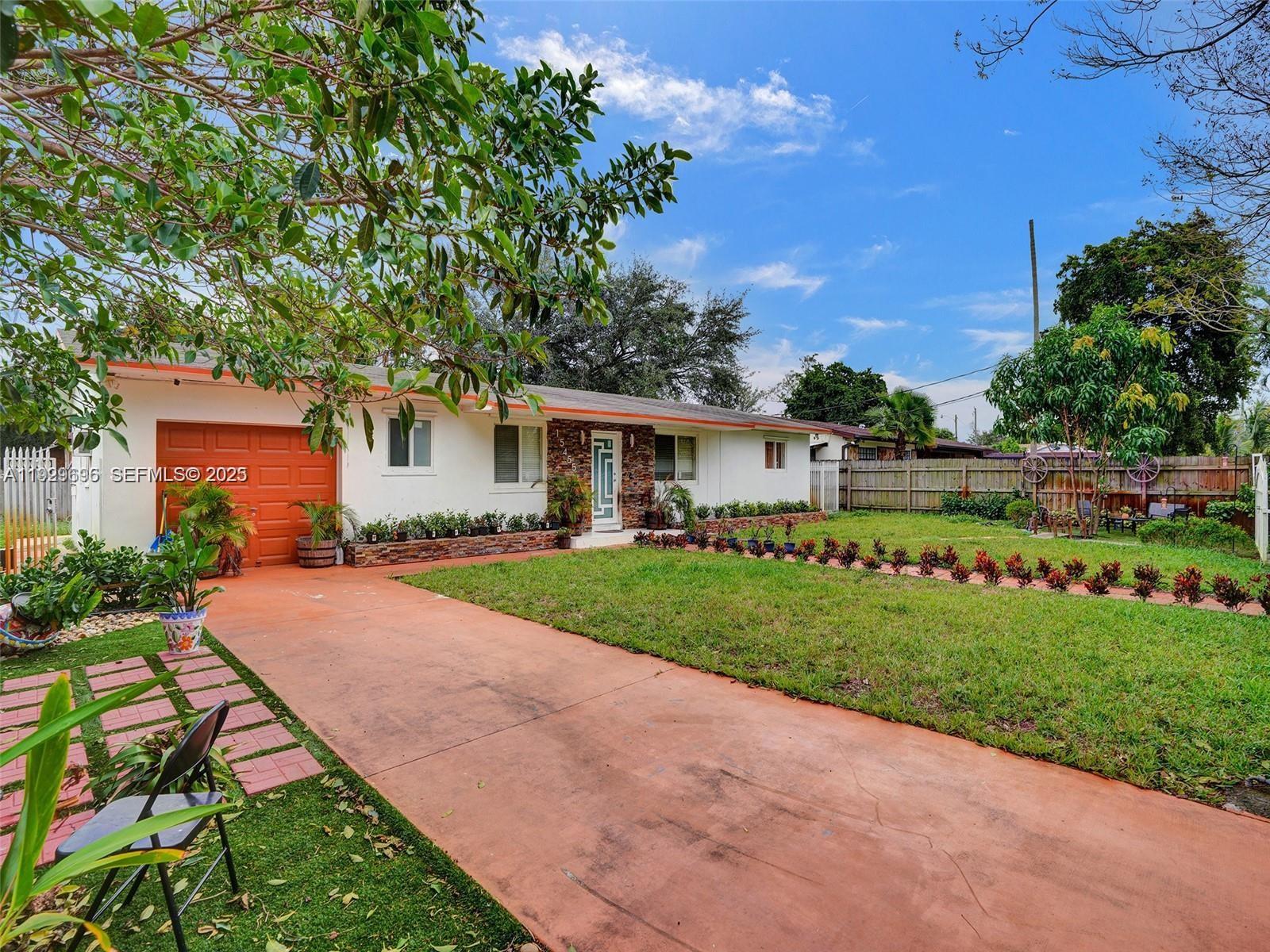 15455 North Miami Avenue, Unit A Miami, FL 33169 - Photo 2 of 10 a front view of a house with a yard and pathway