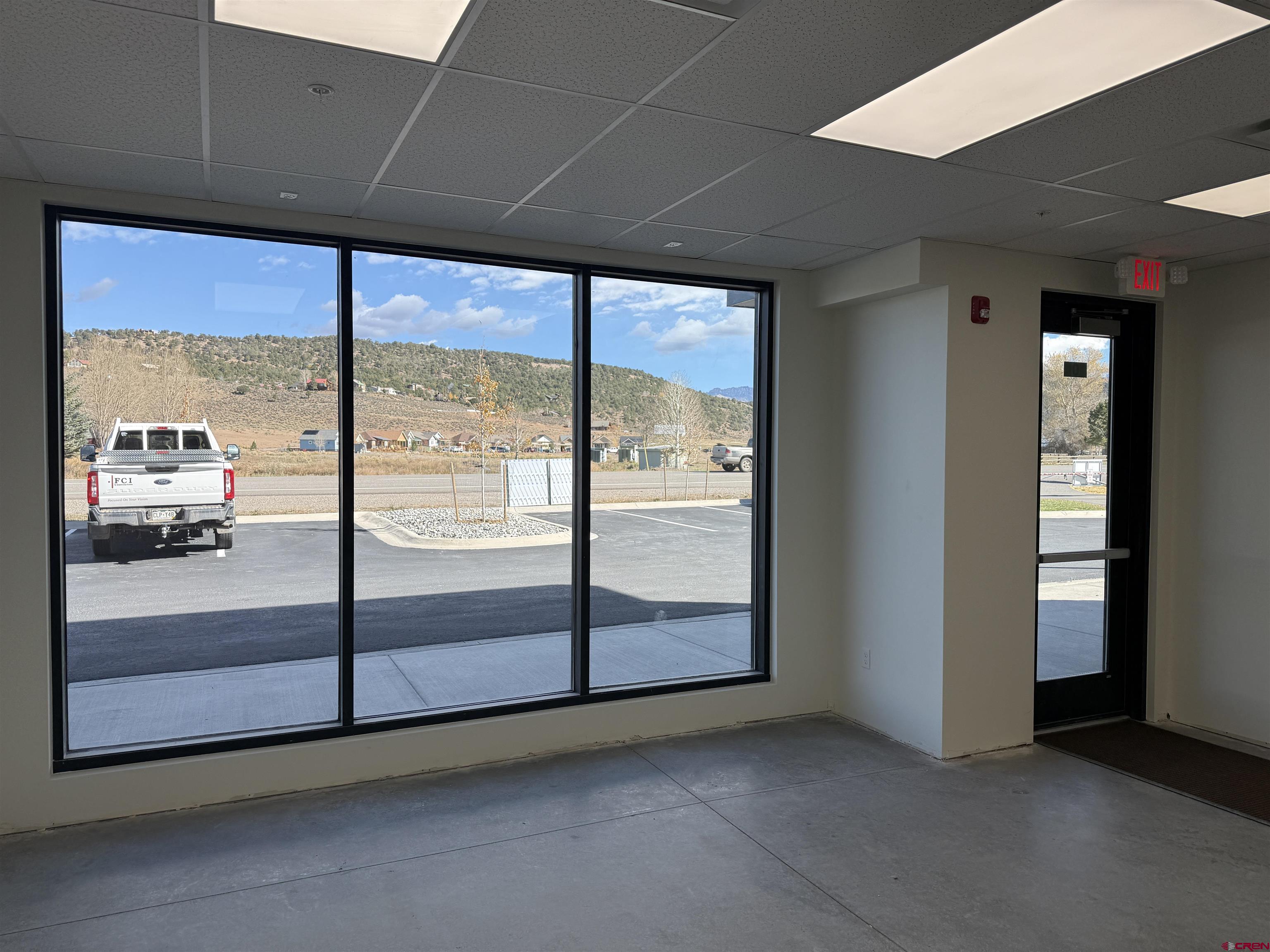 205 Jasper Lane, Unit 102 Ridgway, CO 81432 - Photo 17 of 29 an empty room with sliding glass door