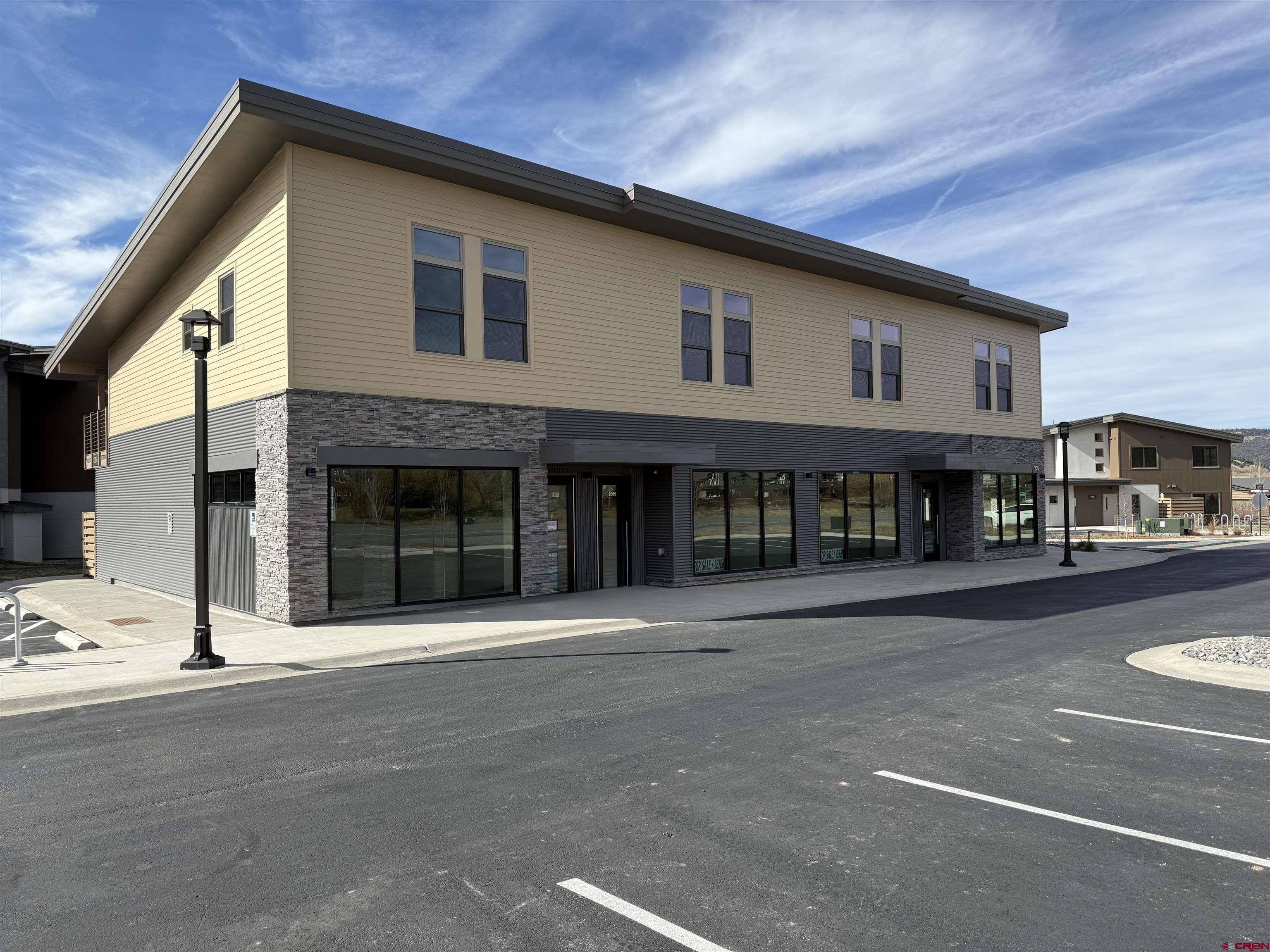 205 Jasper Lane, Unit 102 Ridgway, CO 81432 - Photo 3 of 29 a front view of building with street