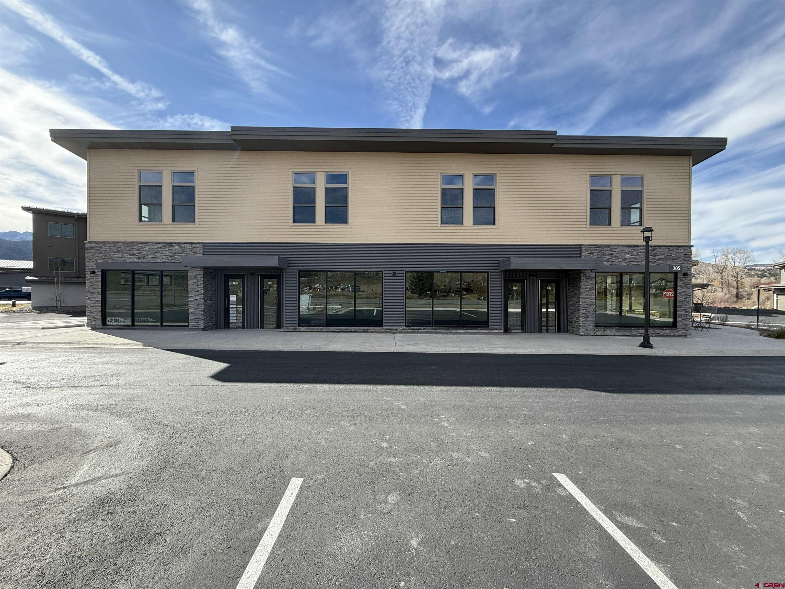 205 Jasper Lane, Unit 102 Ridgway, CO 81432 - Photo 10 of 29 a front view of a house with a yard