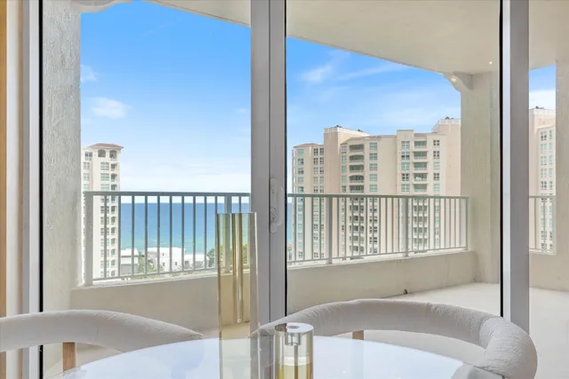 a bathroom with a bathtub and next to a window