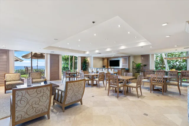 a living room with furniture and flat screen tv