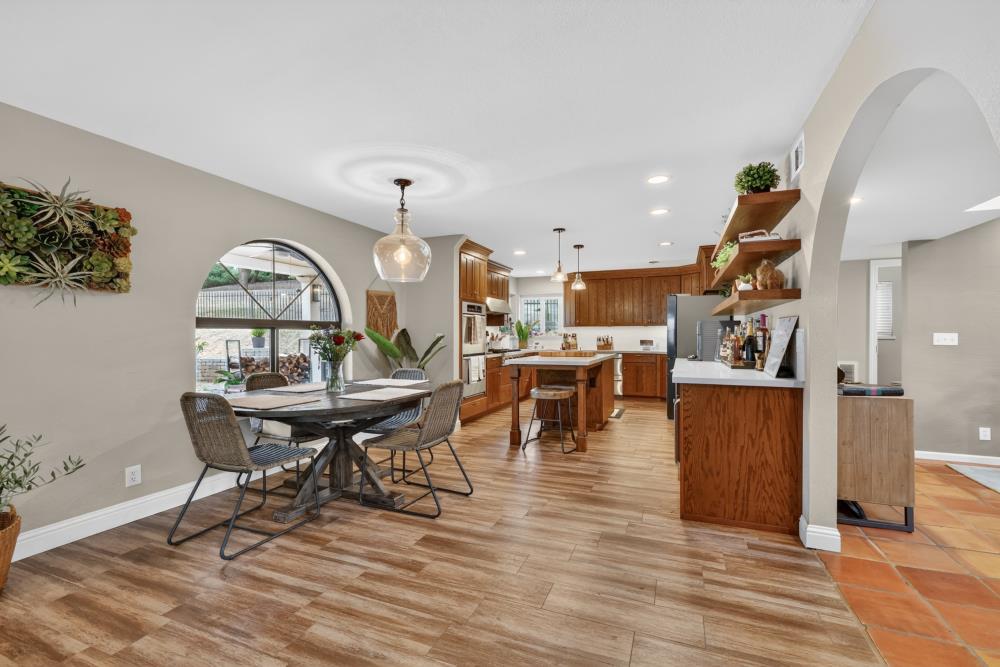 3340 Garden Bar Road Lincoln, CA 95648 - Photo 15 of 56 a view of a dining room with furniture and wooden floor
