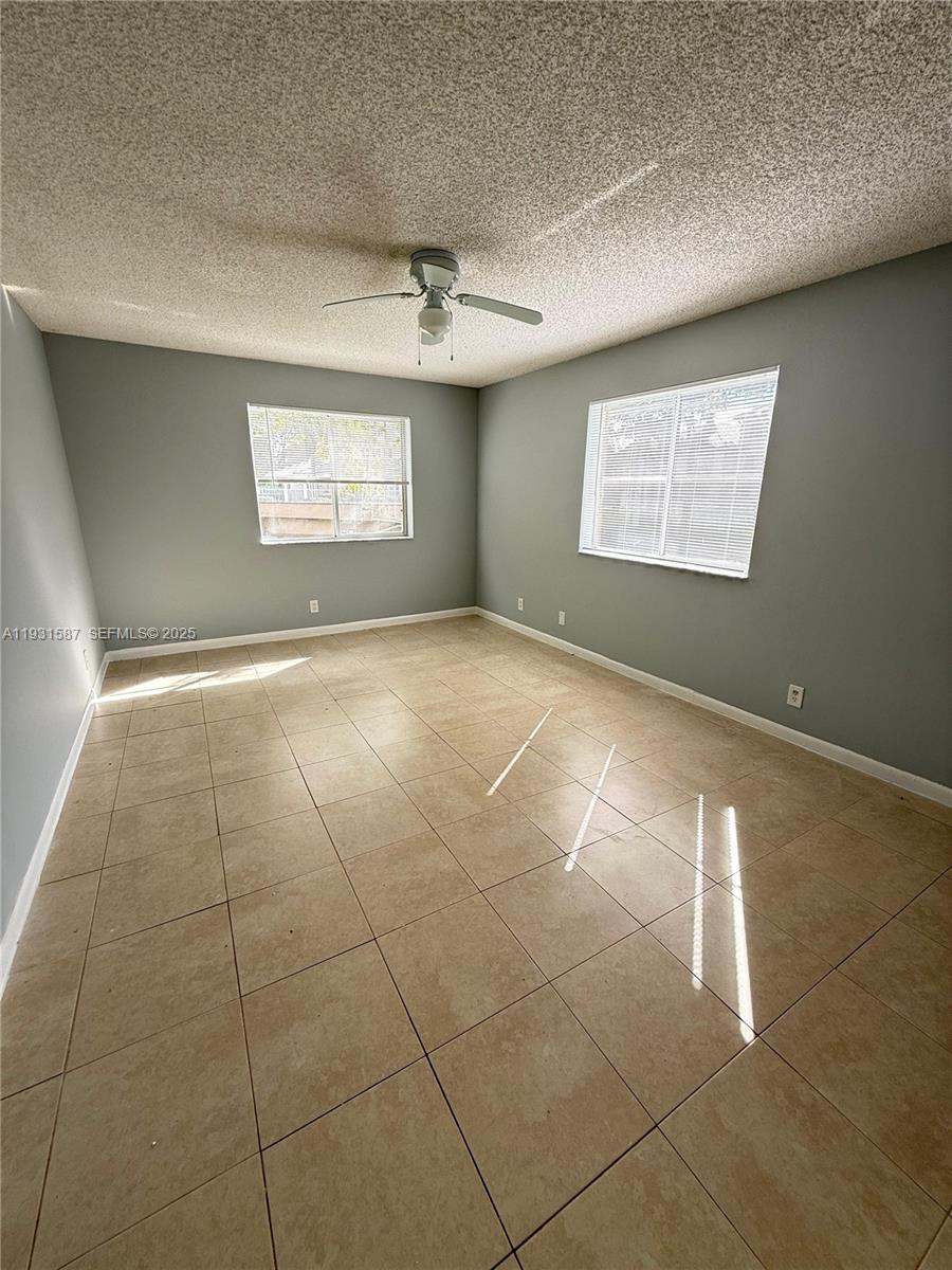 9855 Westview Drive, Unit 711 Coral Springs, FL 33076 - Photo 6 of 12 a view of an empty room with a window