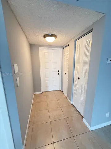 a view of hallway with a front door