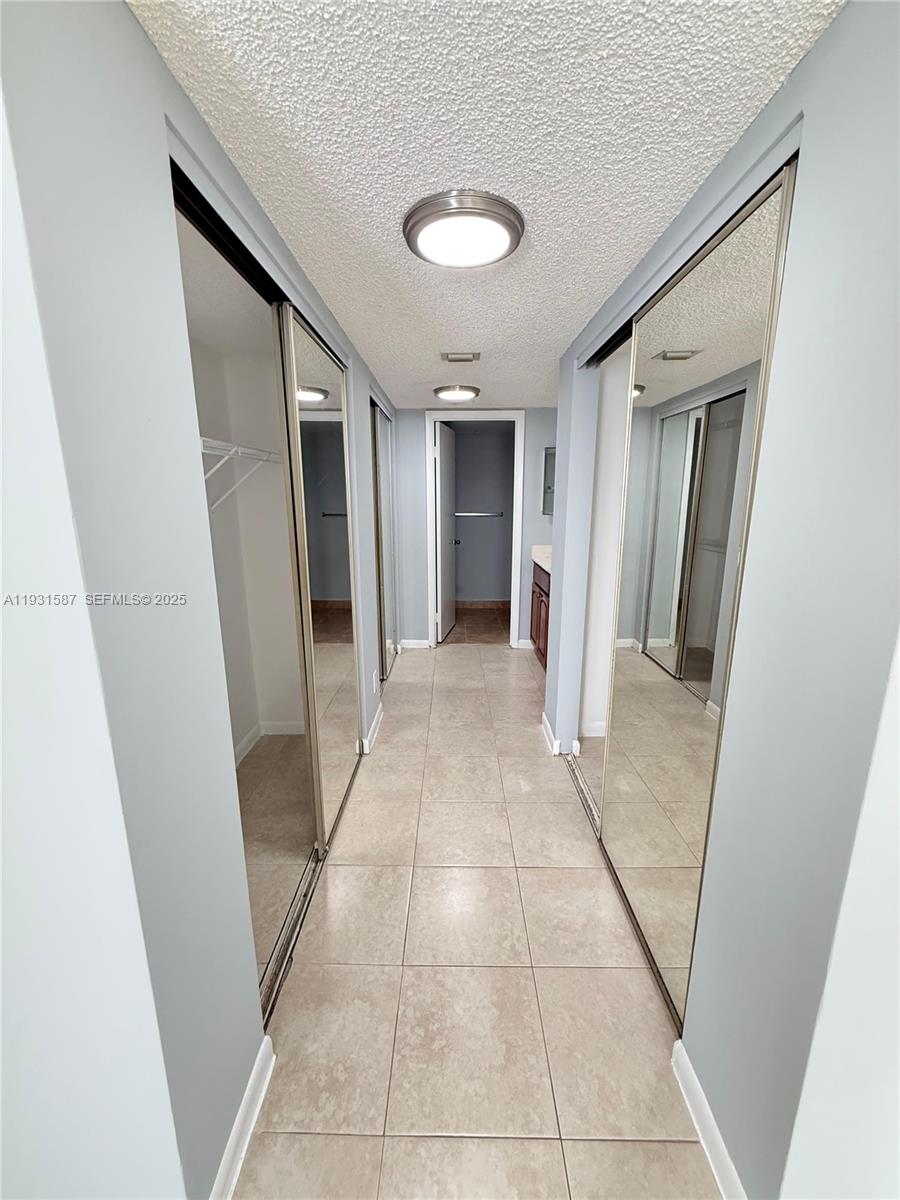 9855 Westview Drive, Unit 711 Coral Springs, FL 33076 - Photo 8 of 12 a view of hallway