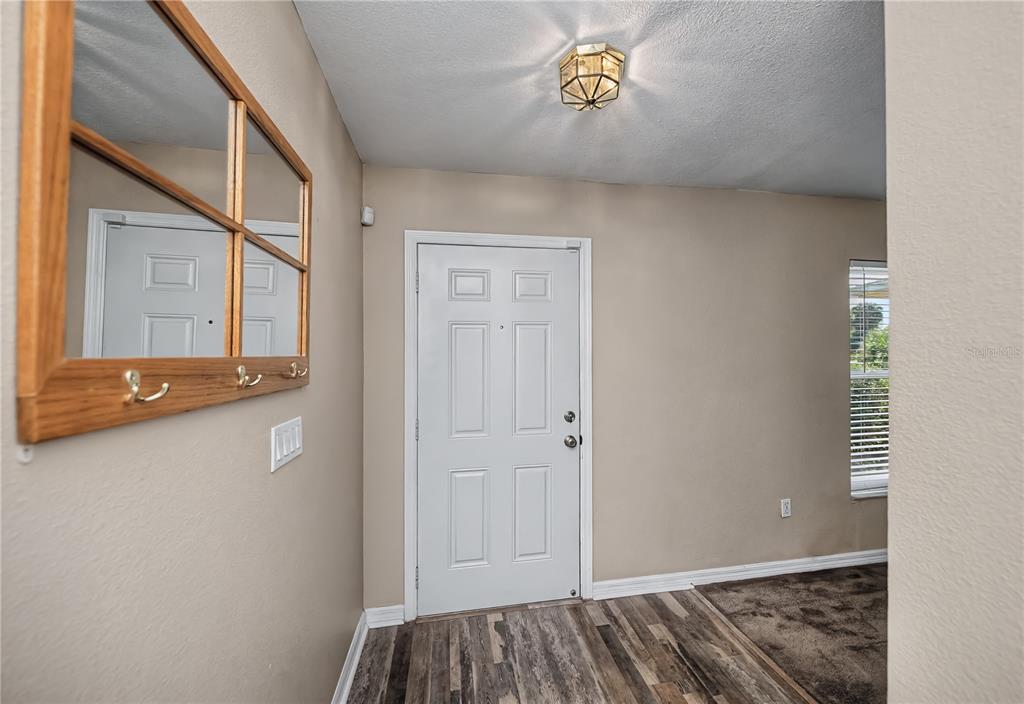 443 Fairmont Terrace Port Charlotte, FL 33954 - Photo 15 of 77 a view of livingroom with furniture and wooden floor