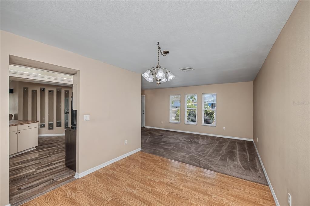 443 Fairmont Terrace Port Charlotte, FL 33954 - Photo 21 of 77 a view of an empty room with wooden floor and a window