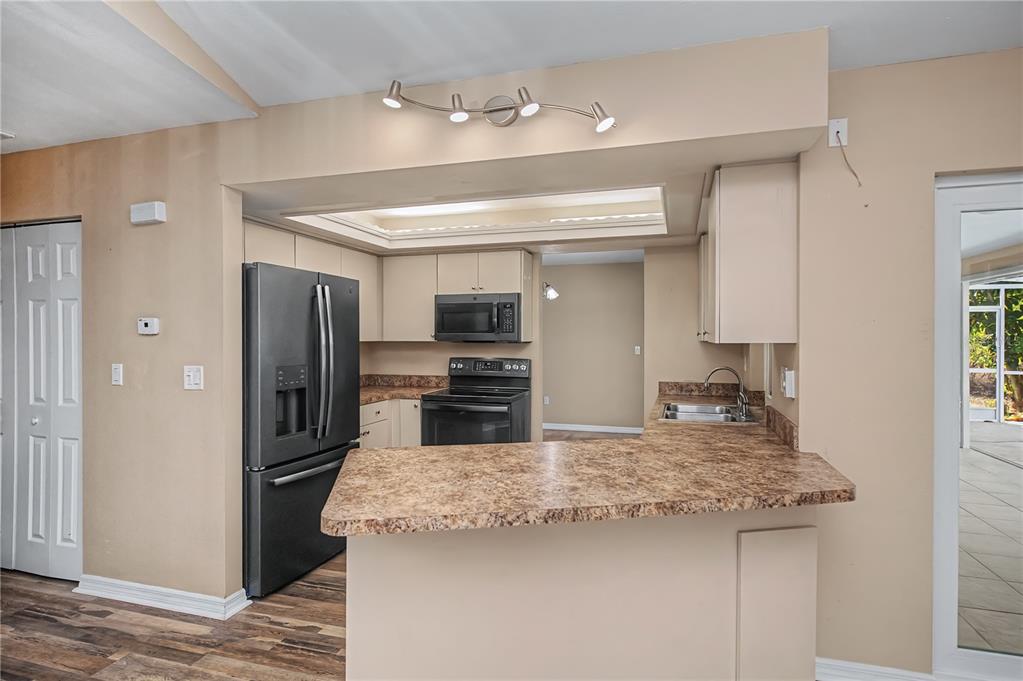 443 Fairmont Terrace Port Charlotte, FL 33954 - Photo 22 of 77 a kitchen with stainless steel appliances granite countertop a refrigerator and a sink