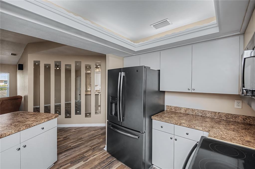 443 Fairmont Terrace Port Charlotte, FL 33954 - Photo 28 of 77 a kitchen with granite countertop a refrigerator and a sink