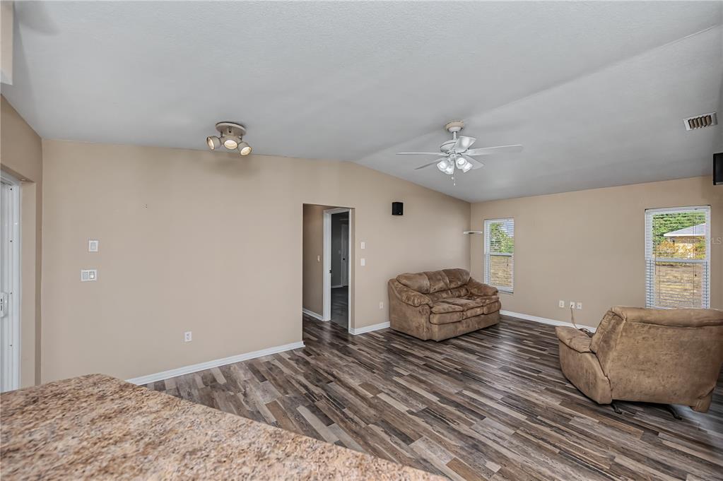 443 Fairmont Terrace Port Charlotte, FL 33954 - Photo 30 of 77 a bedroom with a large bed and ceiling fan