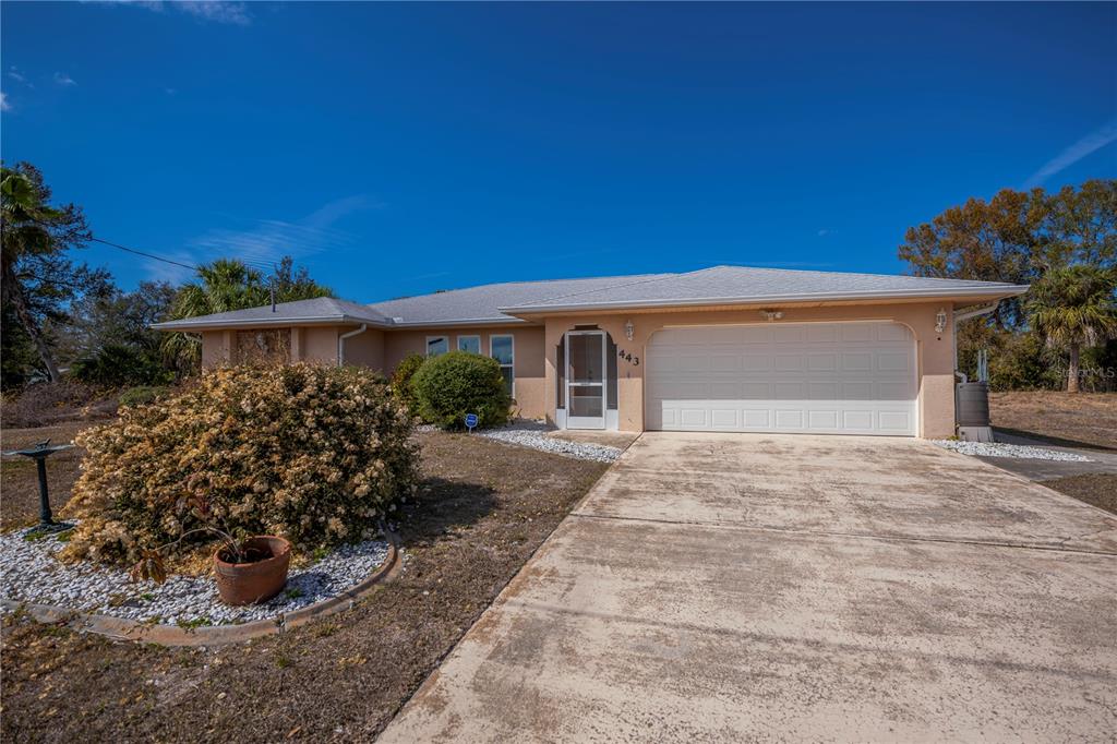443 Fairmont Terrace Port Charlotte, FL 33954 - Photo 3 of 77 a front view of a house with garden