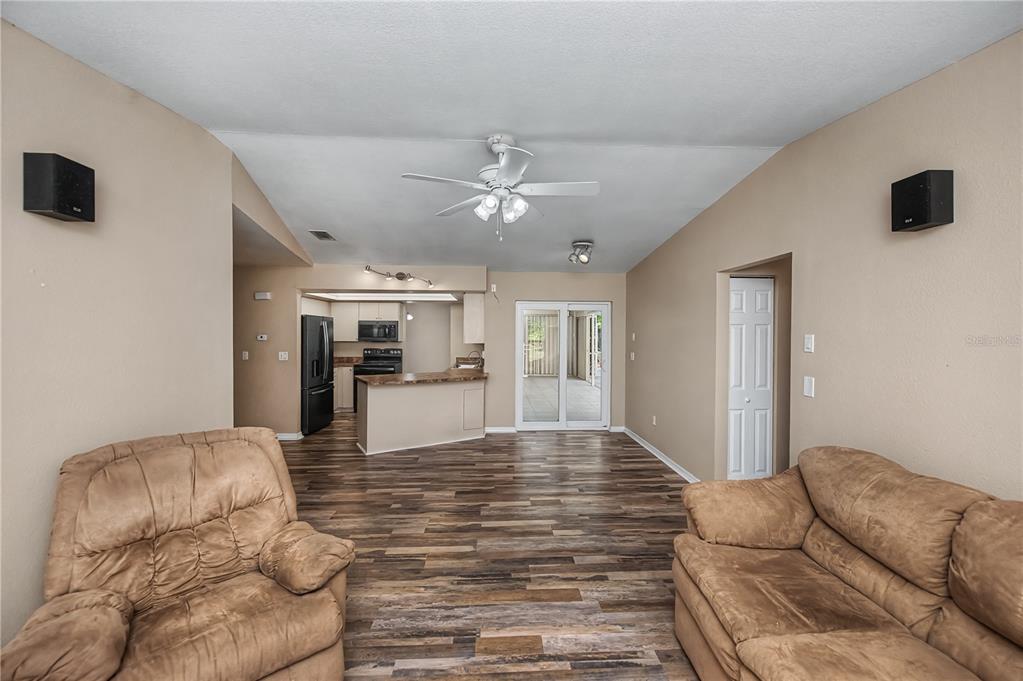 443 Fairmont Terrace Port Charlotte, FL 33954 - Photo 33 of 77 a living room with furniture and a chandelier