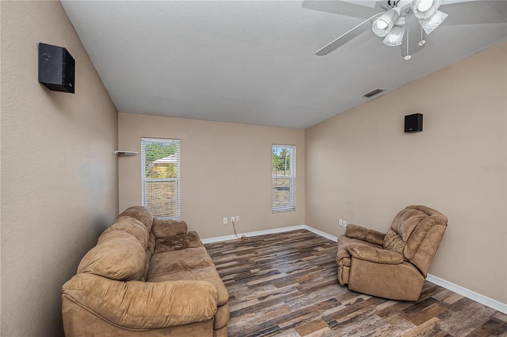 443 Fairmont Terrace Port Charlotte, FL 33954 - Photo 35 of 77 a living room with furniture and a flat screen tv