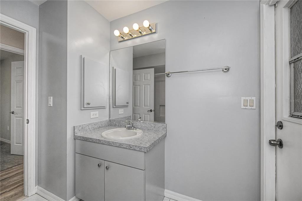 443 Fairmont Terrace Port Charlotte, FL 33954 - Photo 48 of 77 a bathroom with a granite countertop sink a mirror and shower