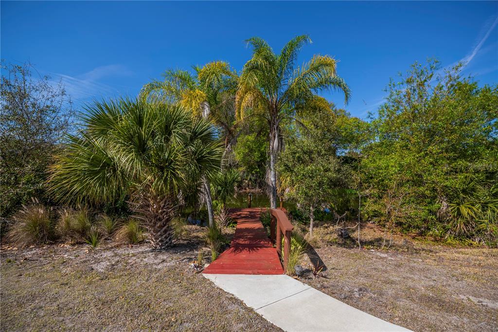 443 Fairmont Terrace Port Charlotte, FL 33954 - Photo 68 of 77 a backyard of a house with table and chairs