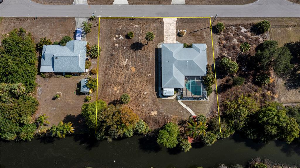 443 Fairmont Terrace Port Charlotte, FL 33954 - Photo 7 of 77 an aerial view of a house with a yard and garden
