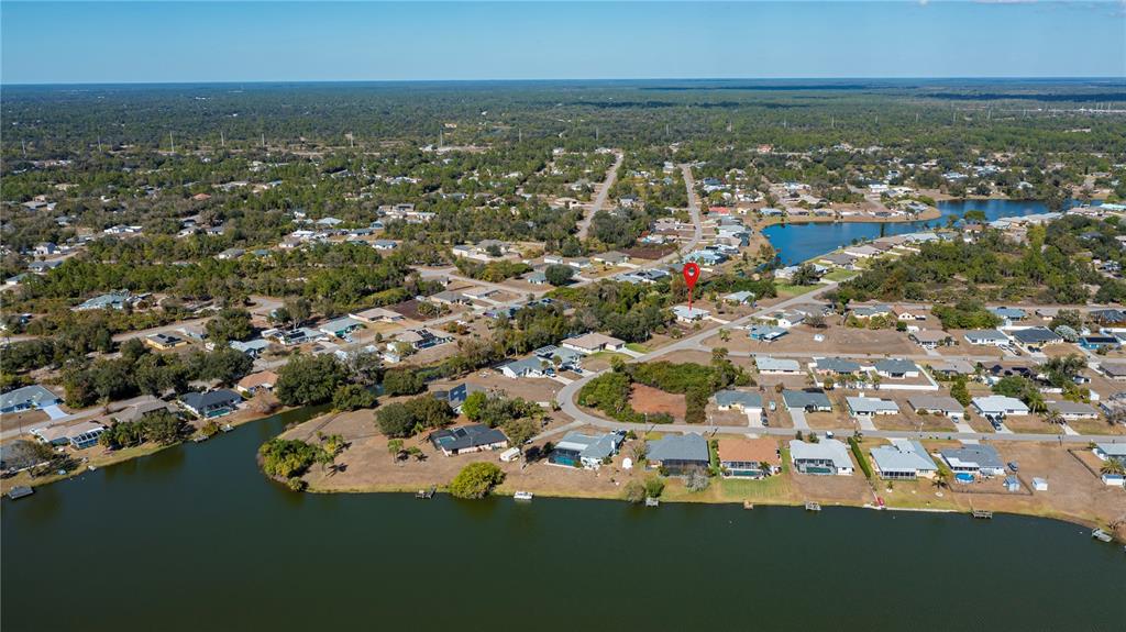 443 Fairmont Terrace Port Charlotte, FL 33954 - Photo 10 of 77 an aerial view of residential houses with outdoor space and lake view