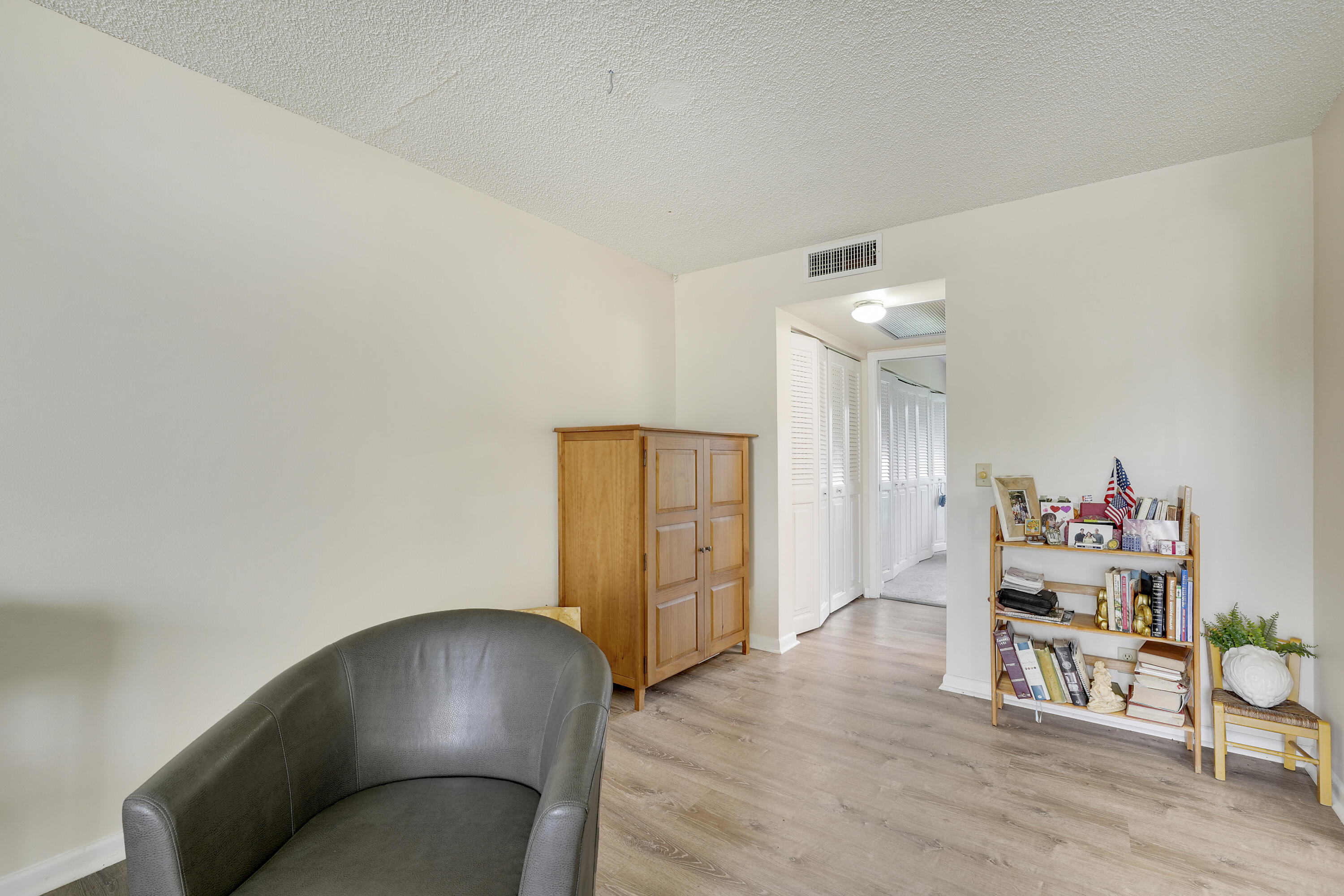16 Mansfield B Boca Raton, FL 33434 - Photo 5 of 15 a living room with furniture and a wooden floor
