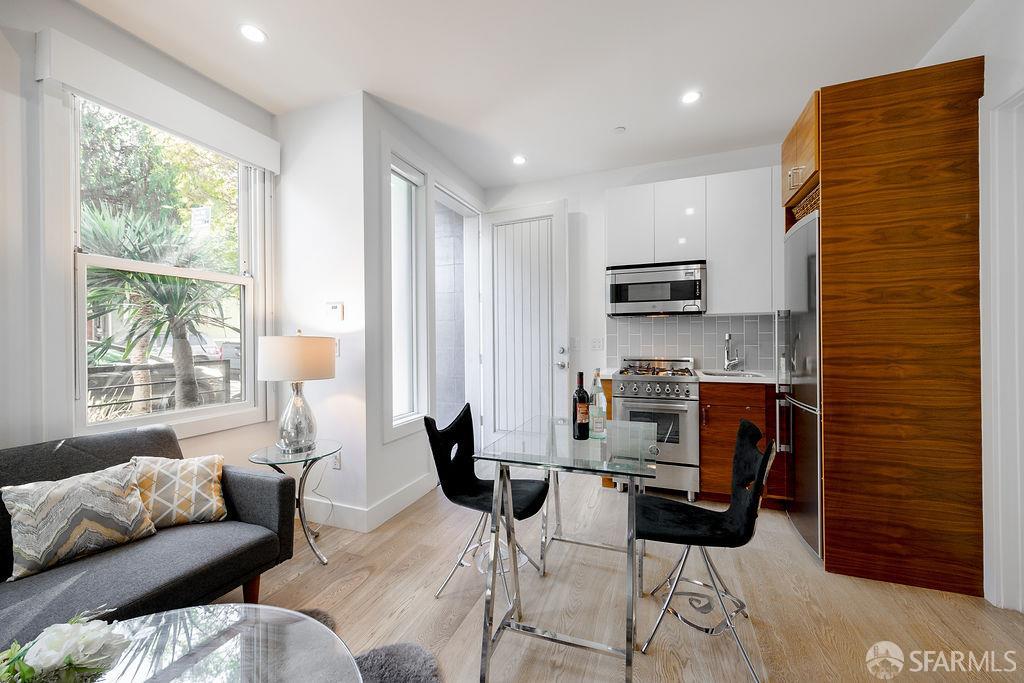 3418 26th Street, Unit 1 San Francisco, CA 94110 - Photo 4 of 20 a workspace with furniture and a window