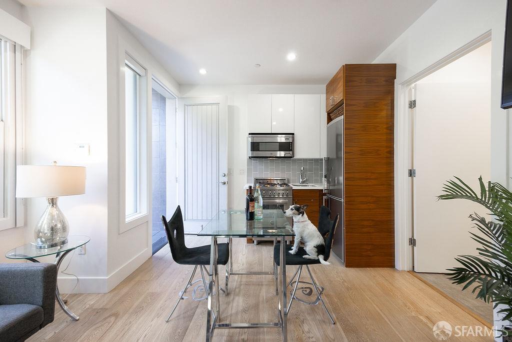 3418 26th Street, Unit 1 San Francisco, CA 94110 - Photo 5 of 20 a living room with furniture a lamp and a potted plant