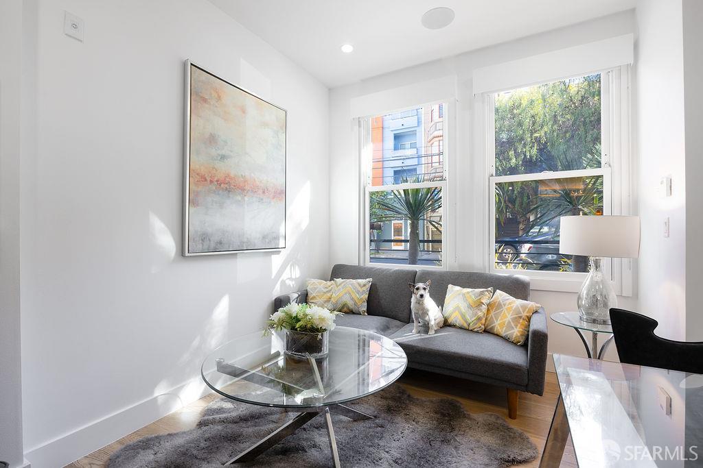 3418 26th Street, Unit 1 San Francisco, CA 94110 - Photo 9 of 20 a living room with furniture and a large window