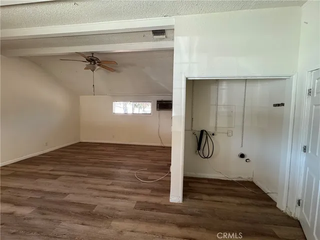 a bathroom with a glass shower door and a window