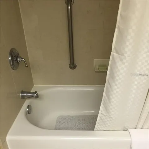 a bathroom with a bath tub