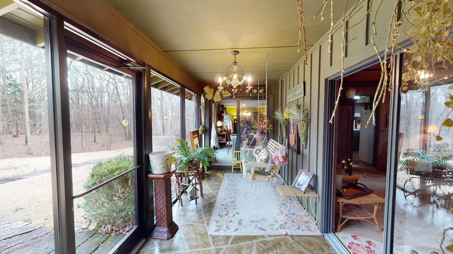 3445 Highway 142 Counce, TN 38326 - Photo 12 of 25 a room with lots of potted plants and wooden floor