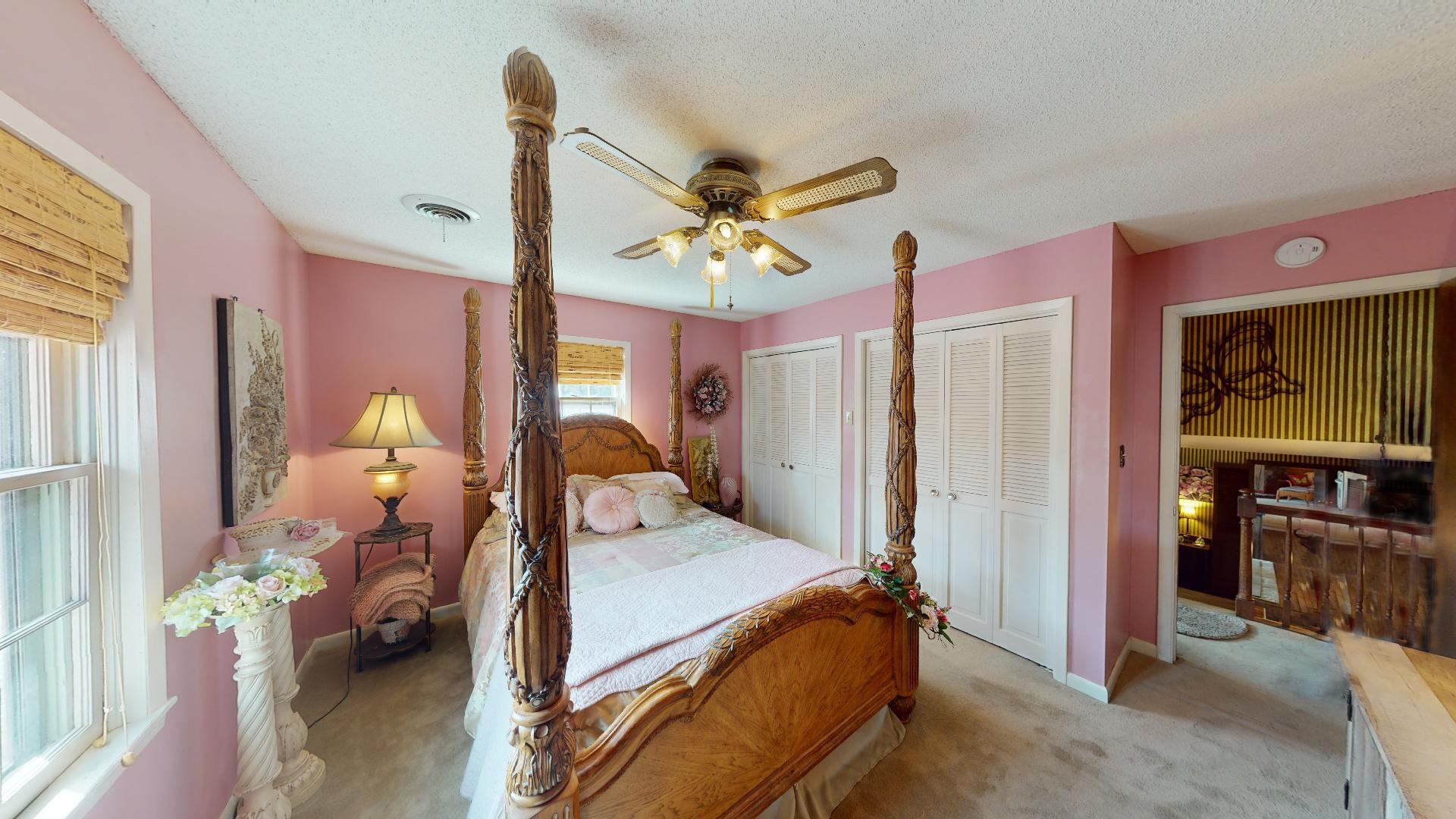 3445 Highway 142 Counce, TN 38326 - Photo 13 of 25 a bedroom with a bed and a chandelier