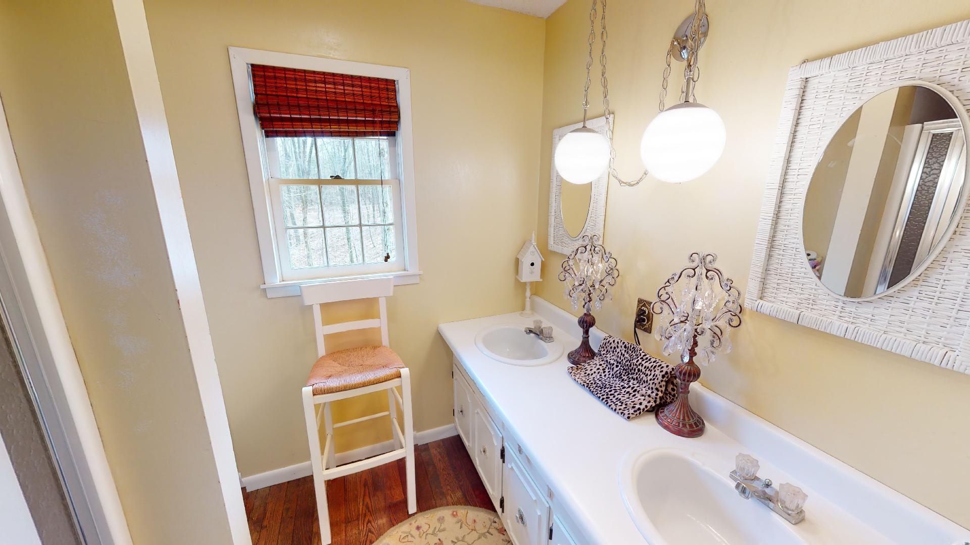 3445 Highway 142 Counce, TN 38326 - Photo 18 of 25 a bathroom with a sink a mirror and vanity