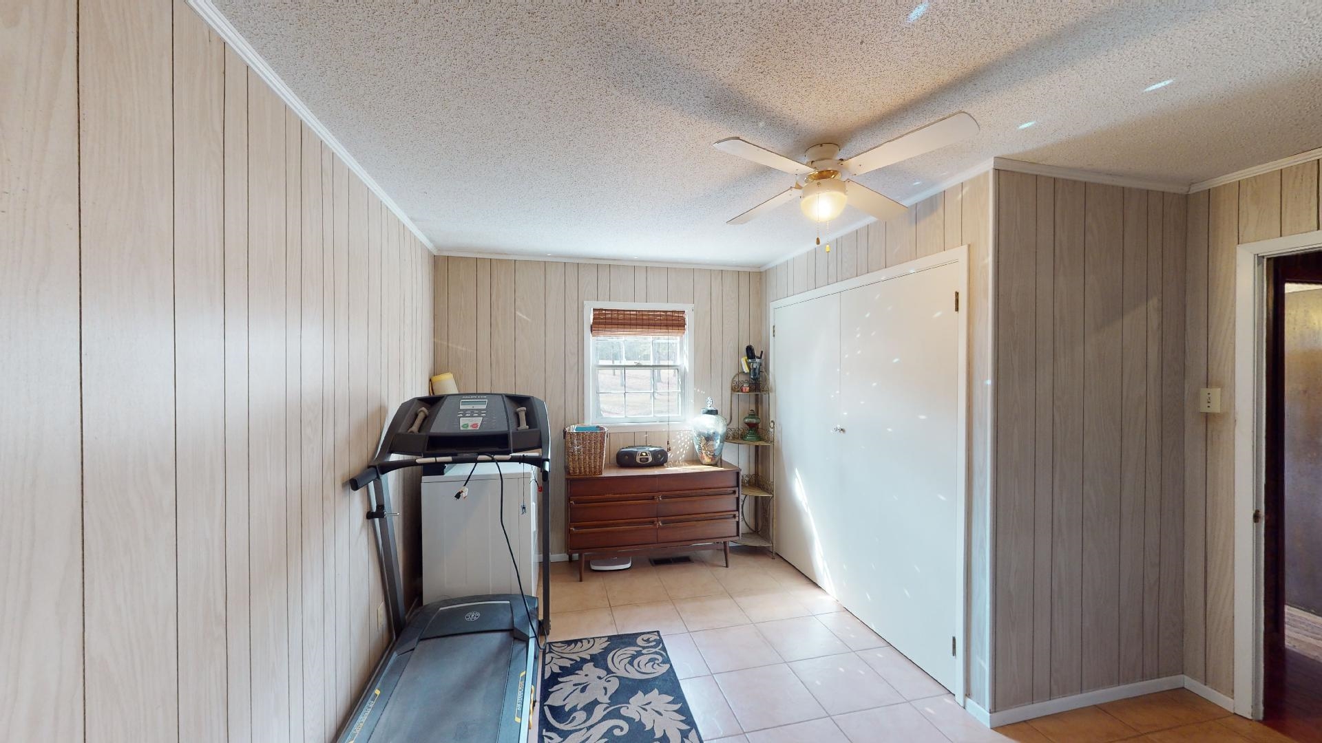 3445 Highway 142 Counce, TN 38326 - Photo 19 of 25 a view of a hallway to rooms and a livingroom with furniture