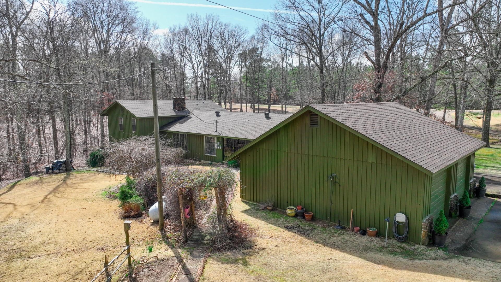 3445 Highway 142 Counce, TN 38326 - Photo 3 of 25 a backyard of a house with table and chairs
