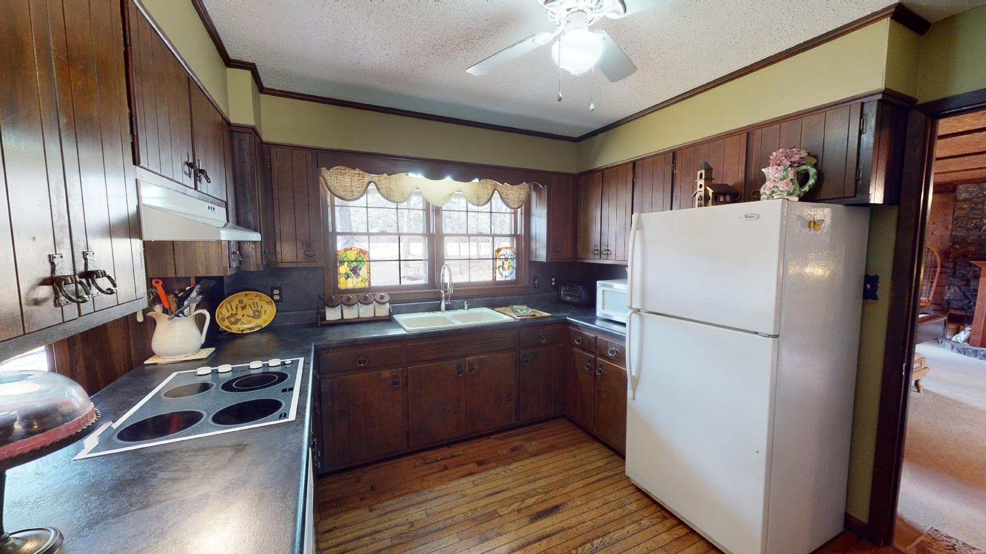3445 Highway 142 Counce, TN 38326 - Photo 7 of 25 a kitchen with refrigerator and window