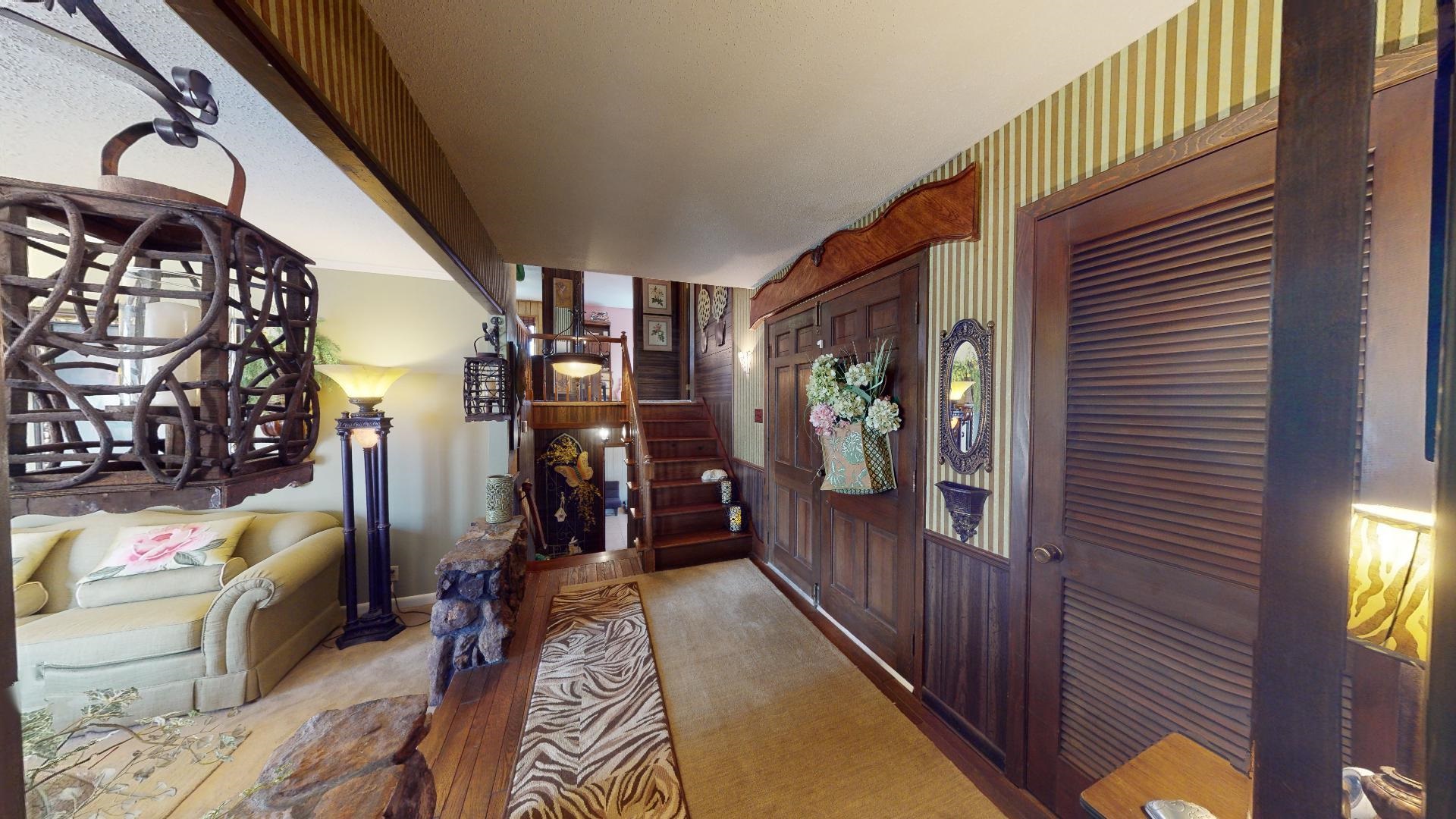 3445 Highway 142 Counce, TN 38326 - Photo 9 of 25 a view of a hallway with wooden floor and windows