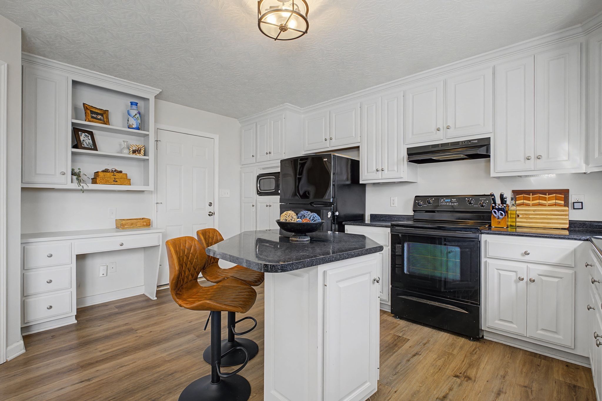 160 Putter Point Drive Gallatin, TN 37066 - Photo 12 of 35 a kitchen with a stove cabinets and wooden floor
