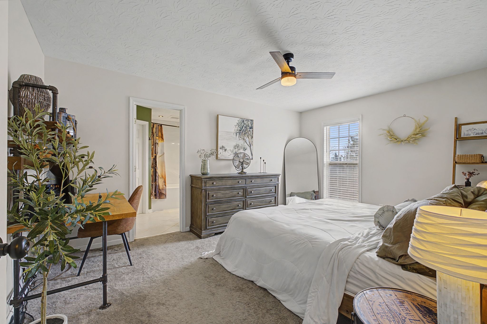 160 Putter Point Drive Gallatin, TN 37066 - Photo 19 of 35 a bedroom with a bed and a chair