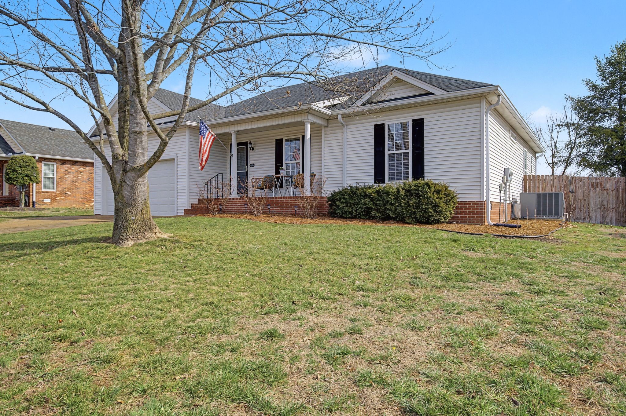 160 Putter Point Drive Gallatin, TN 37066 - Photo 2 of 35 a front view of a house with yard and green space