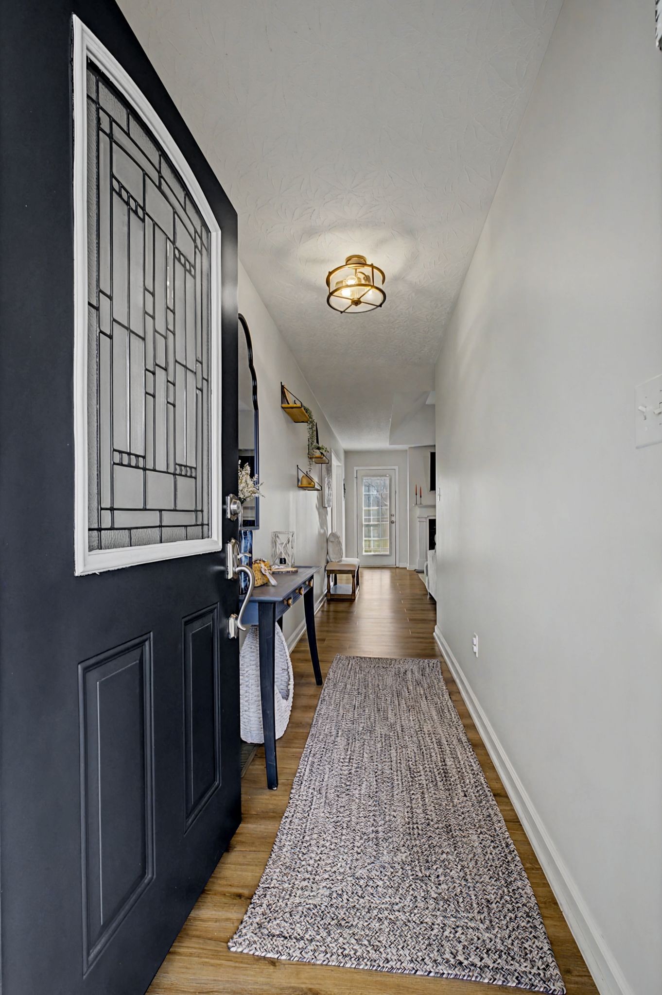 160 Putter Point Drive Gallatin, TN 37066 - Photo 5 of 35 a living room with stainless steel appliances furniture a rug and a window
