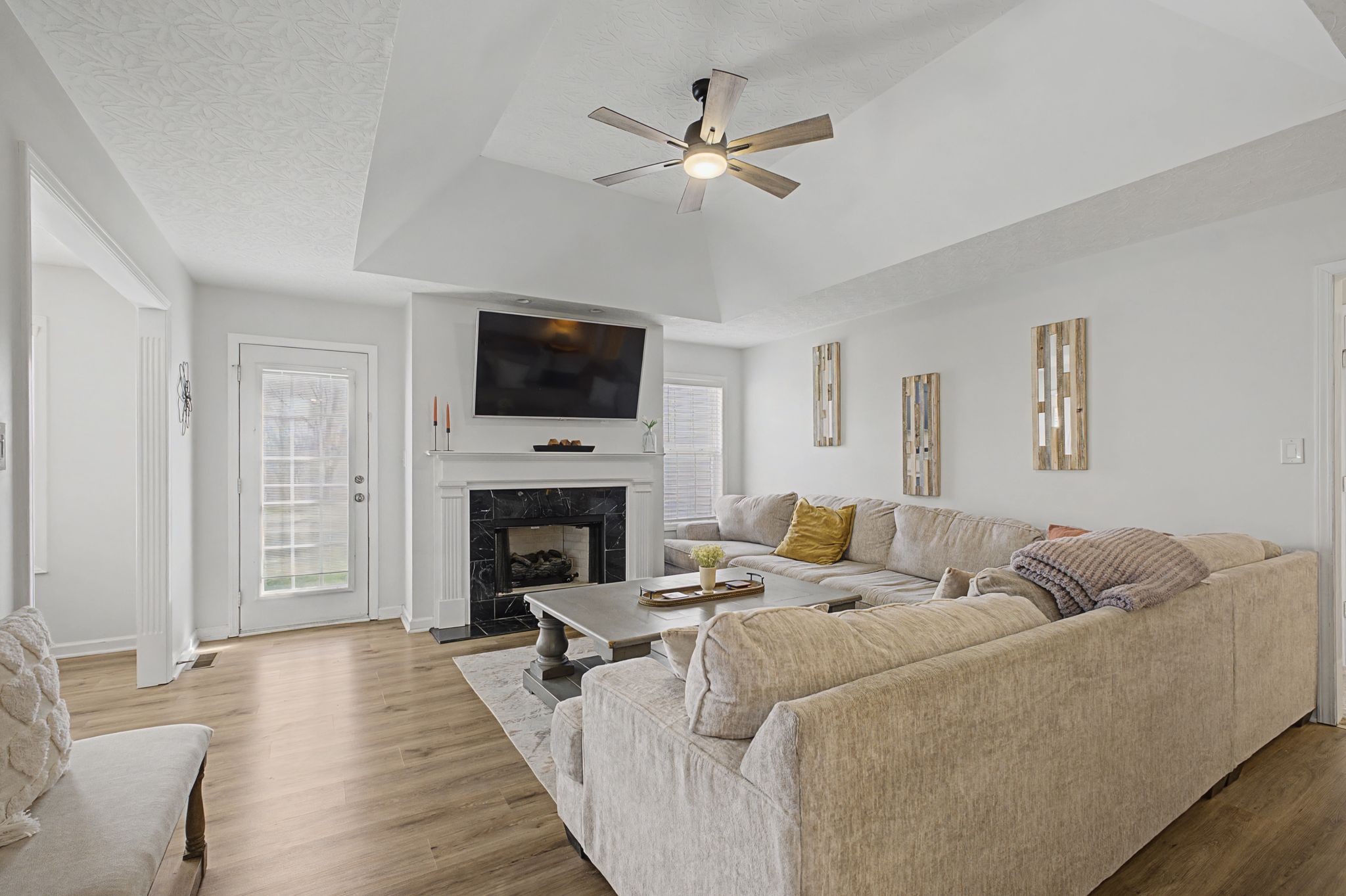160 Putter Point Drive Gallatin, TN 37066 - Photo 6 of 35 a living room with furniture a fireplace and a flat screen tv