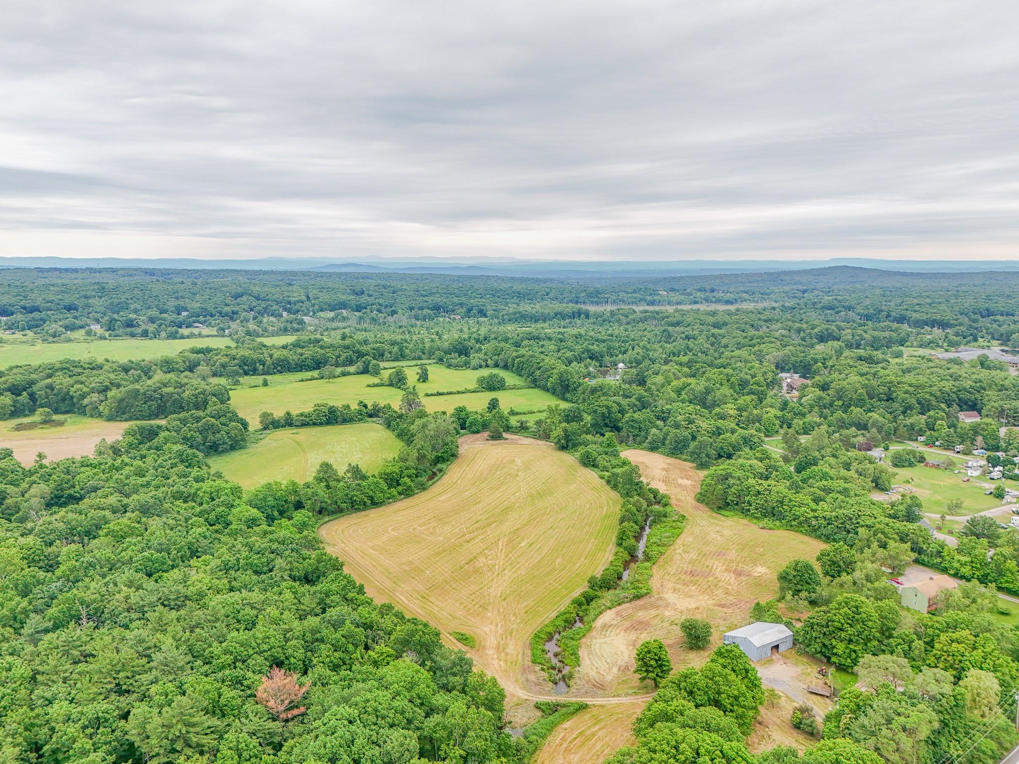 4986 32nd Route Catskill, NY 12414 - Photo 6 of 7 a view of a lake with a yard