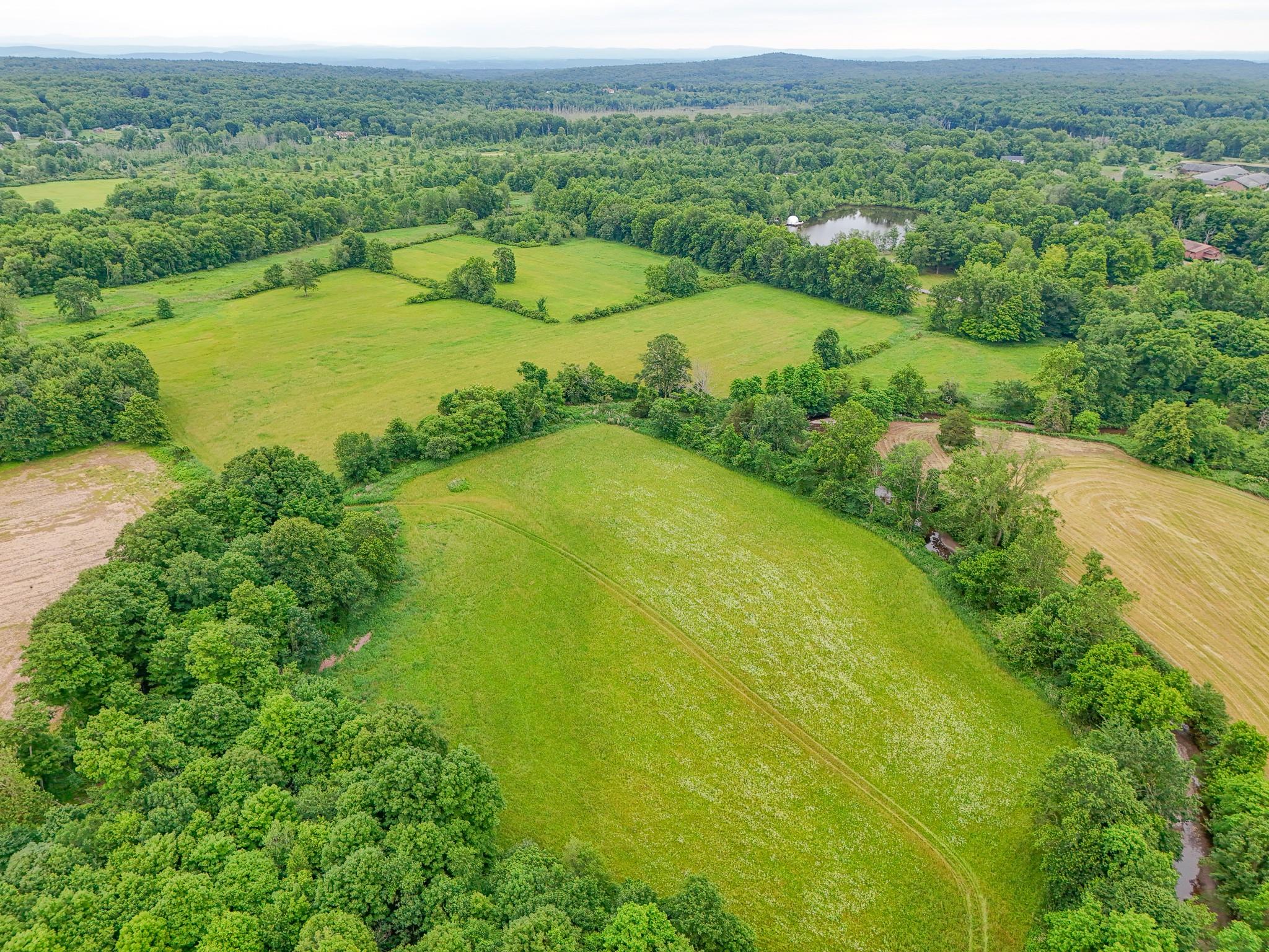 4986 32nd Route Catskill, NY 12414 - Photo 7 of 7 a view of a lake with a big yard