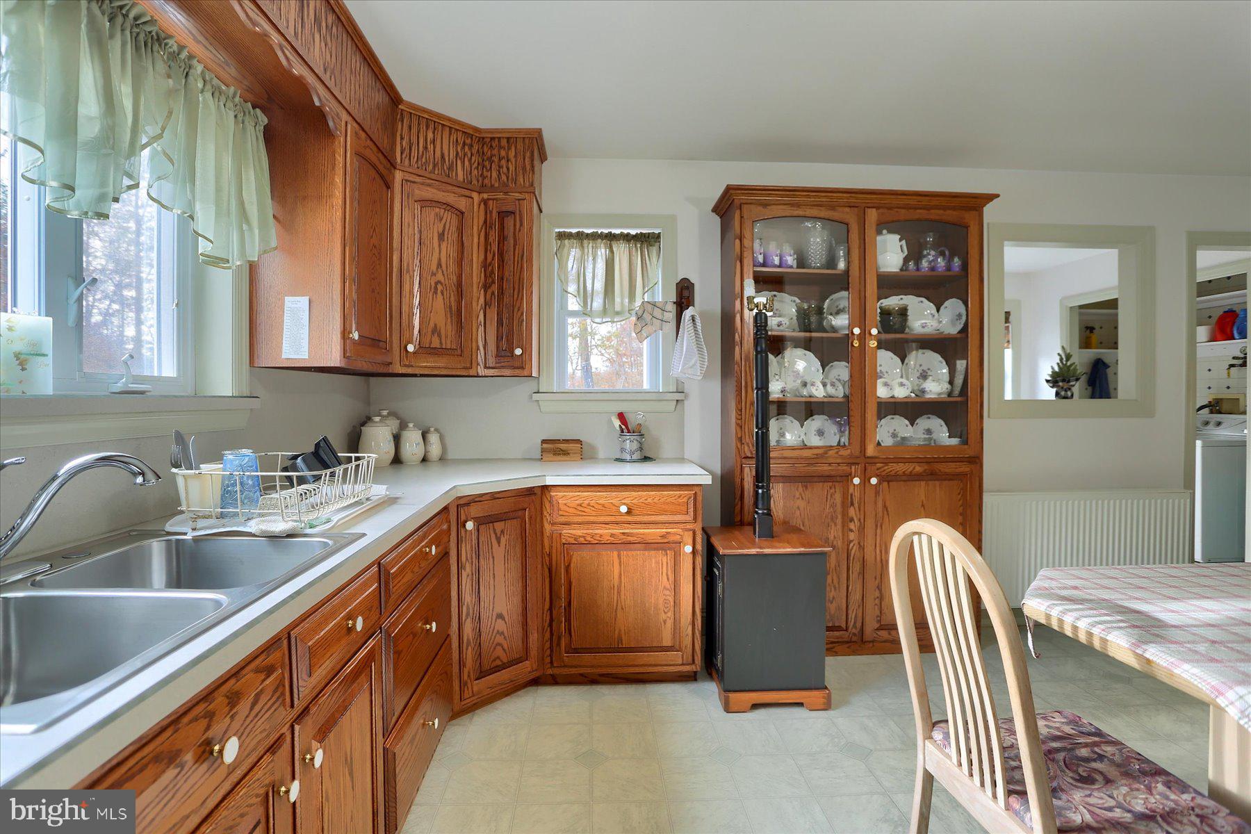 7504 Raccoon Valley Road Millerstown, PA 17062 - Photo 13 of 71 a kitchen with stainless steel appliances granite countertop a sink dishwasher stove top oven and refrigerator