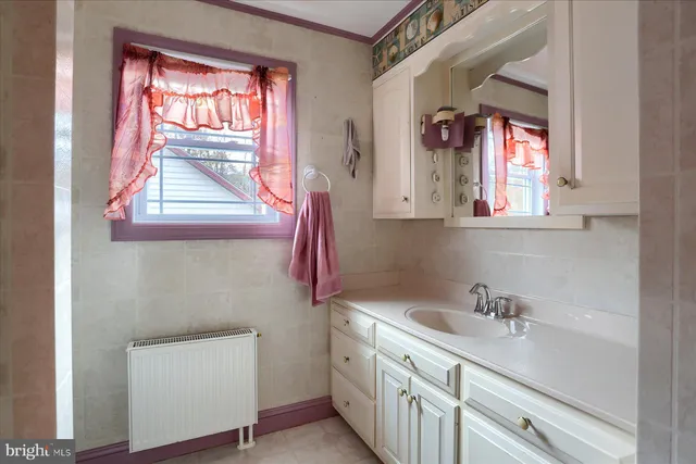 a bedroom with a bed and a table in it