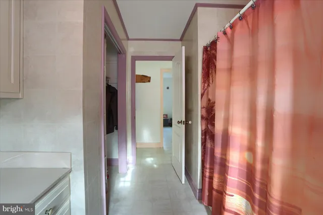 a bedroom with a bed and a table in it