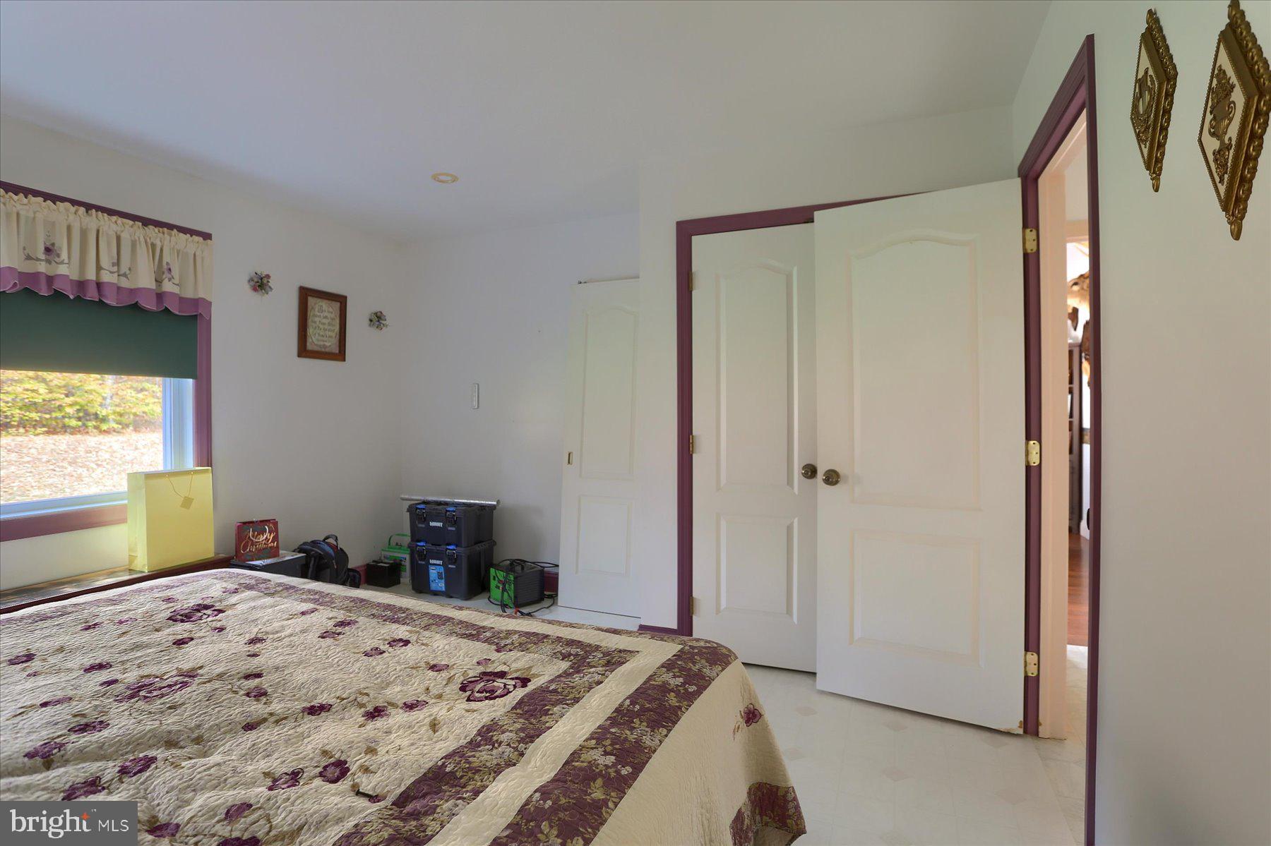 7504 Raccoon Valley Road Millerstown, PA 17062 - Photo 23 of 71 a bedroom with a bed and a window