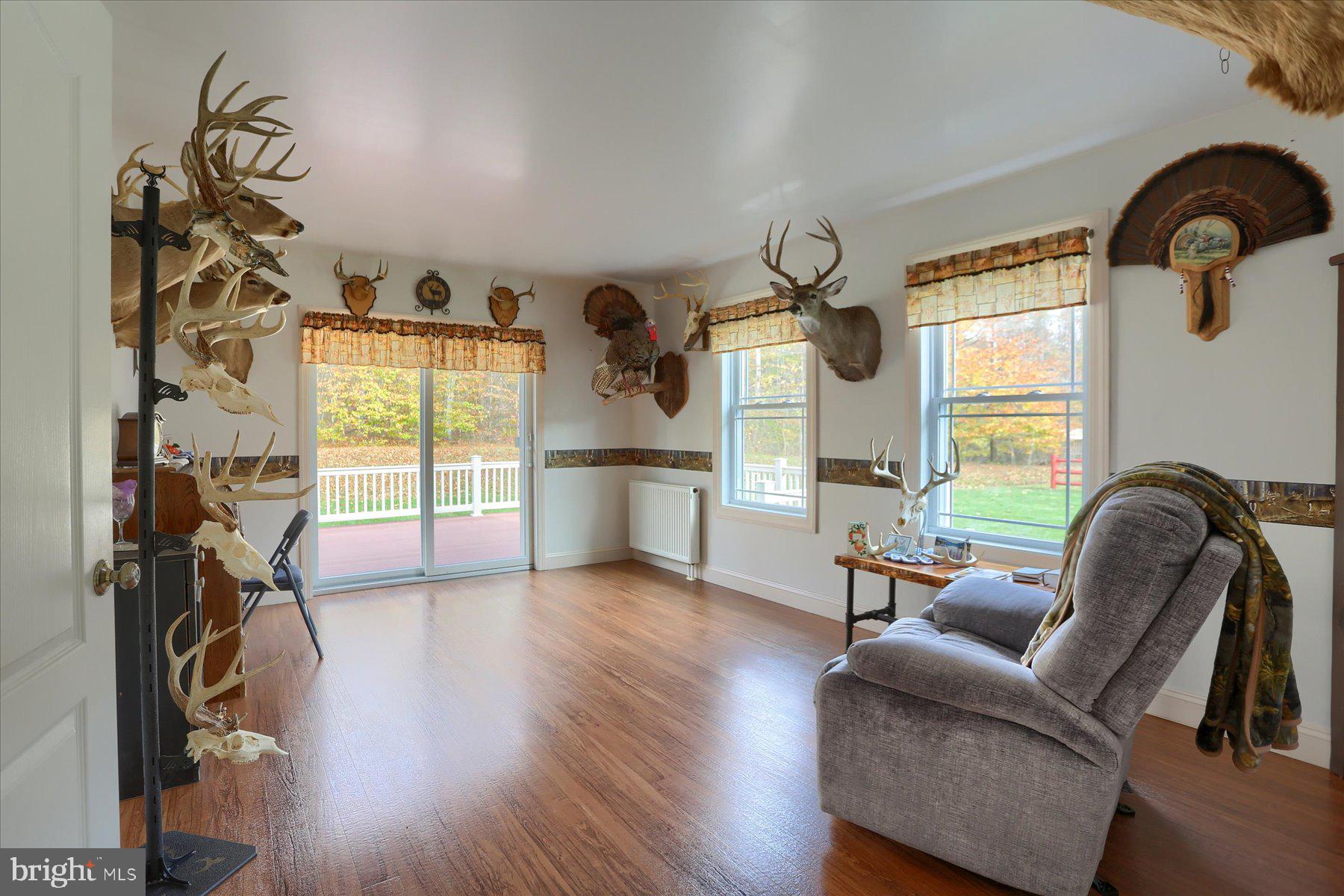 7504 Raccoon Valley Road Millerstown, PA 17062 - Photo 25 of 71 a living room with furniture and a window