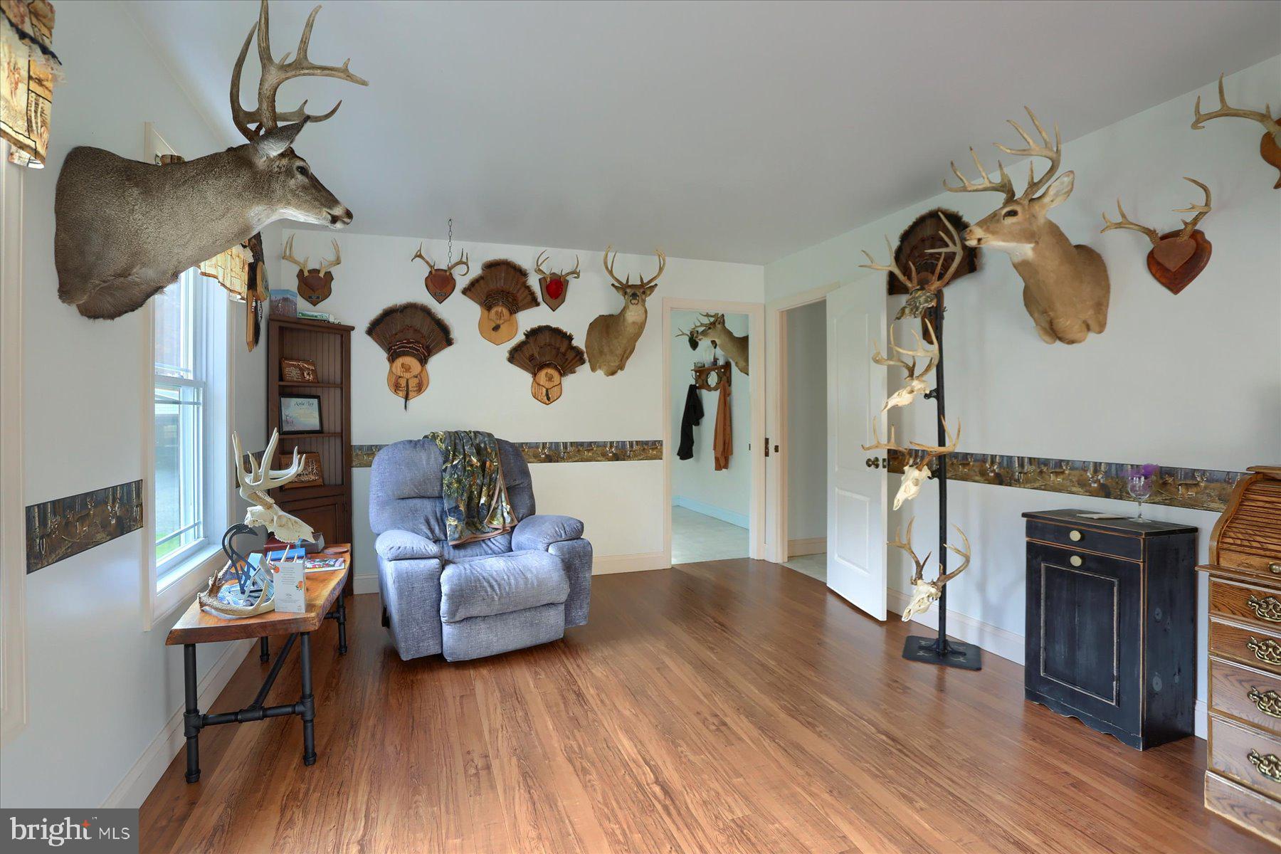 7504 Raccoon Valley Road Millerstown, PA 17062 - Photo 26 of 71 a living room with furniture and wooden floor