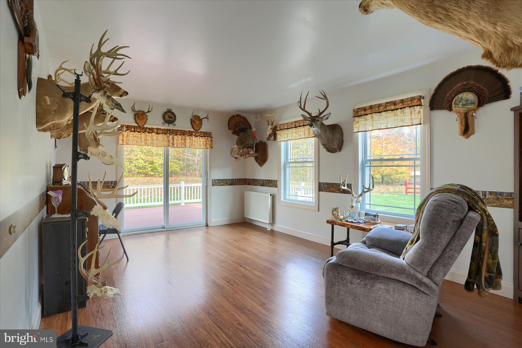 7504 Raccoon Valley Road Millerstown, PA 17062 - Photo 27 of 71 a view of a livingroom with furniture hardwood floor and a window